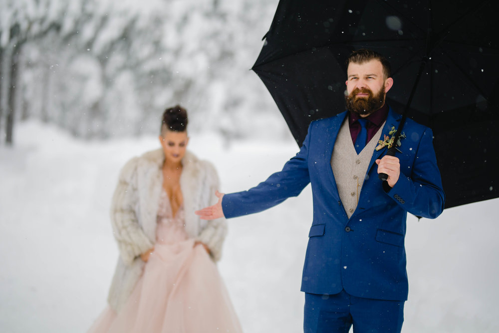 bride and groom about to have their first look in the snow