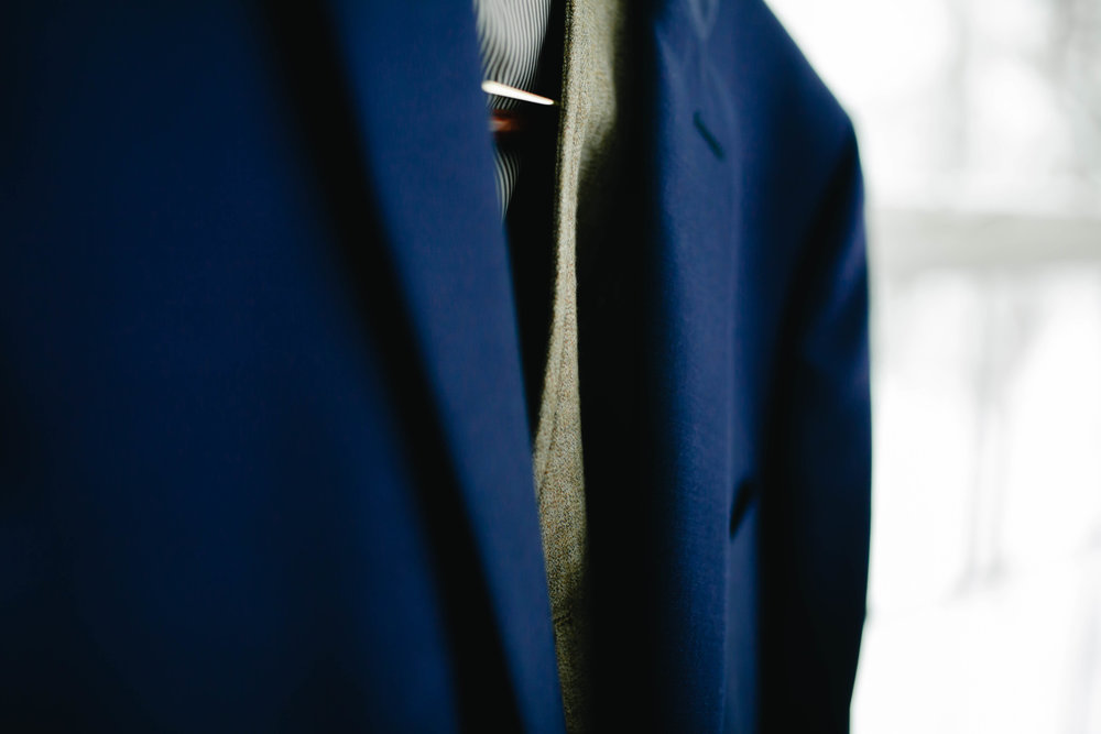 navy blue and twill grooms suit