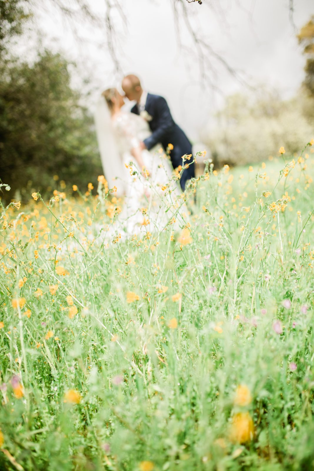 soft focus wedding photo with wildflowers