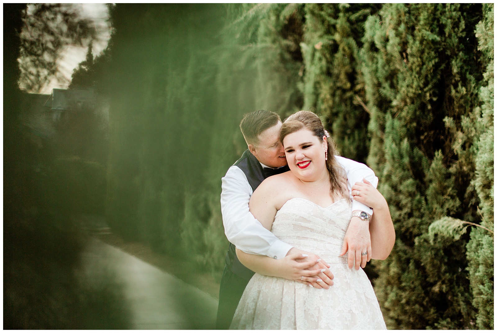 bride and groom embracing during portraits