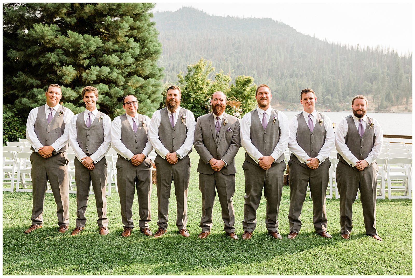 groom and the groomsmen posing outdoors