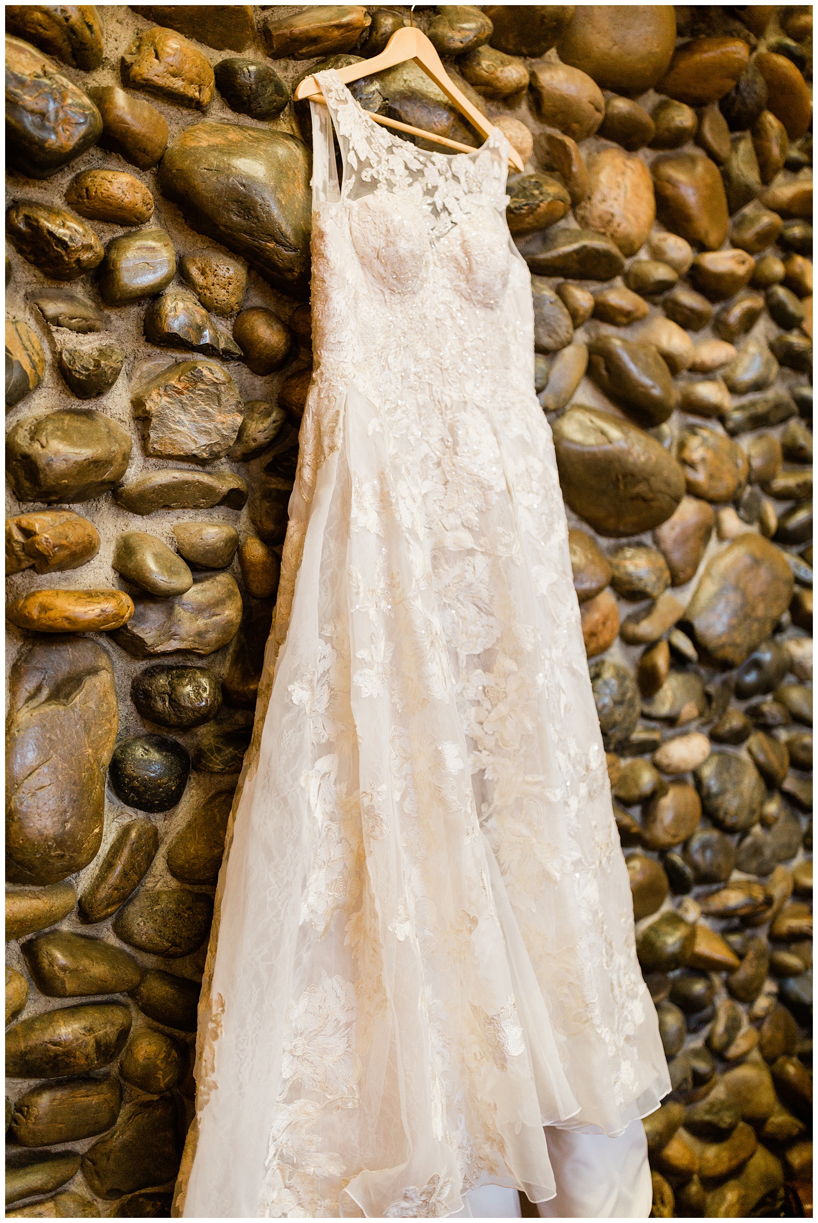wedding dress hanging on the fireplace at Pines Resort in Bass Lake CA
