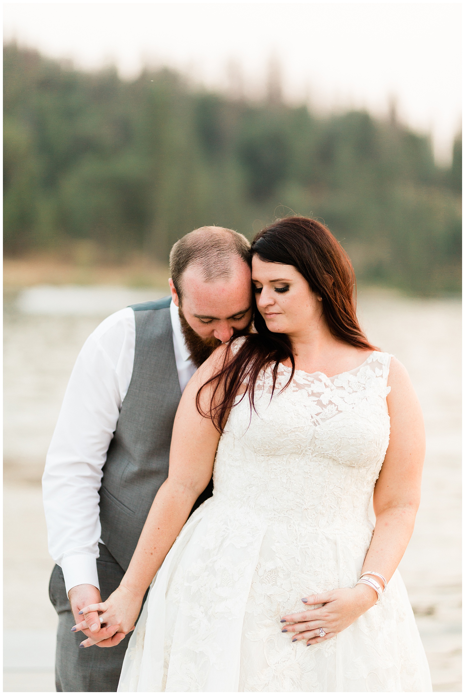 groom kissing his brides shoulder while taking sunset portraits on the docks at the pines resort in bass lake