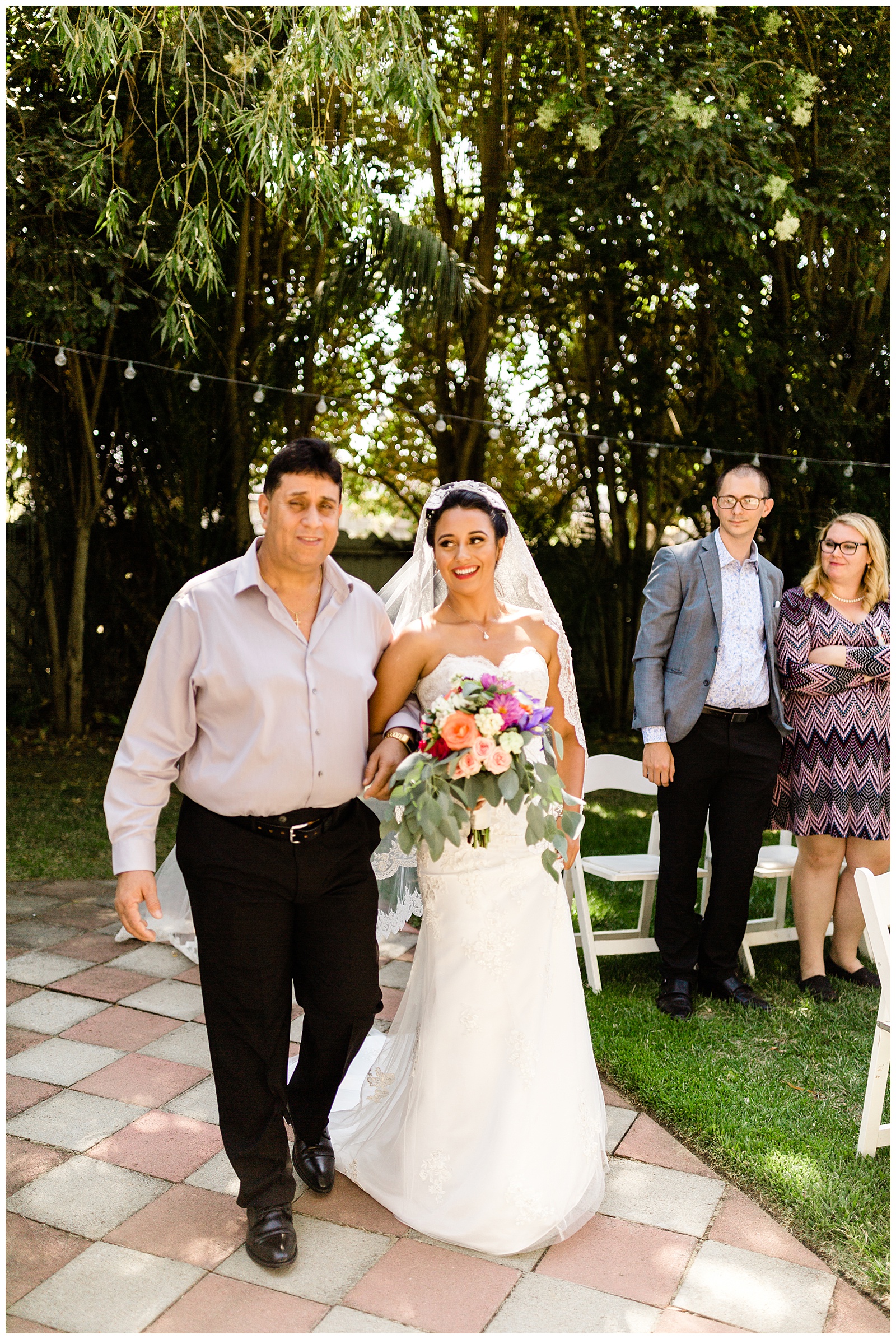 bride and her father walking down the asile