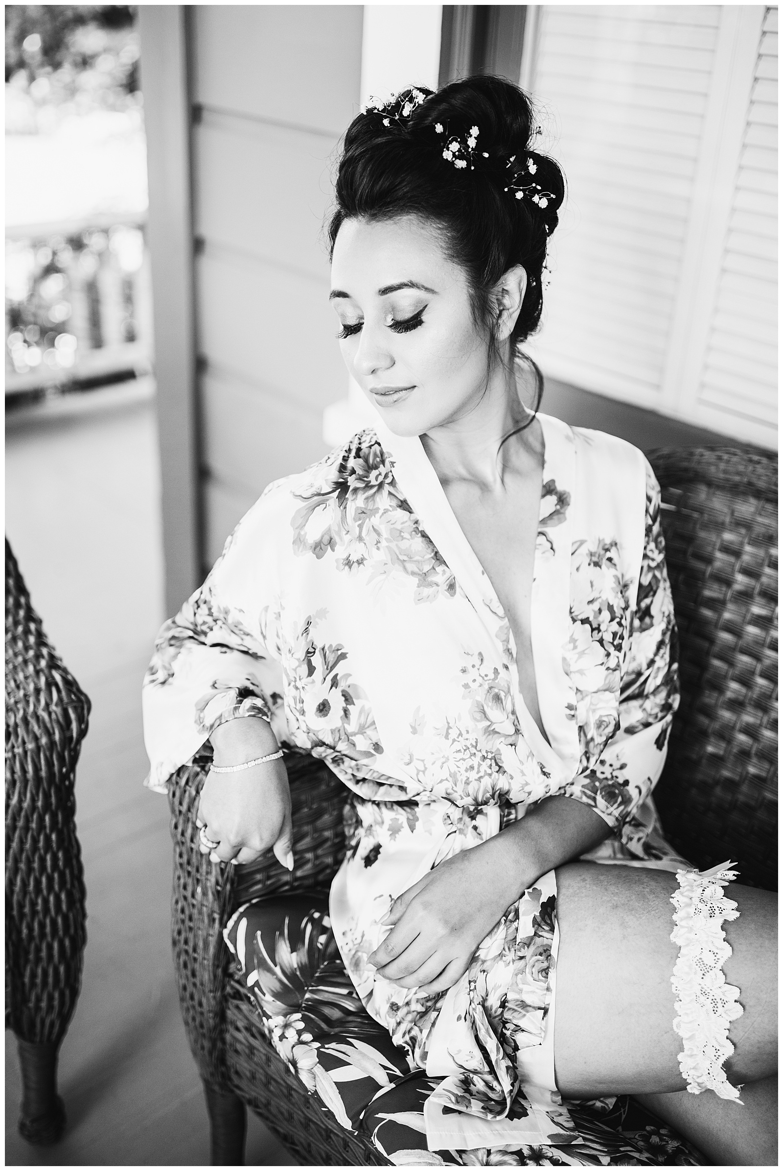 black and white photo of a bride in a floral robe