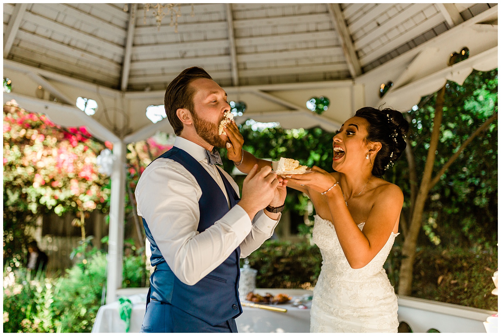 bride smashing cake in the grooms face