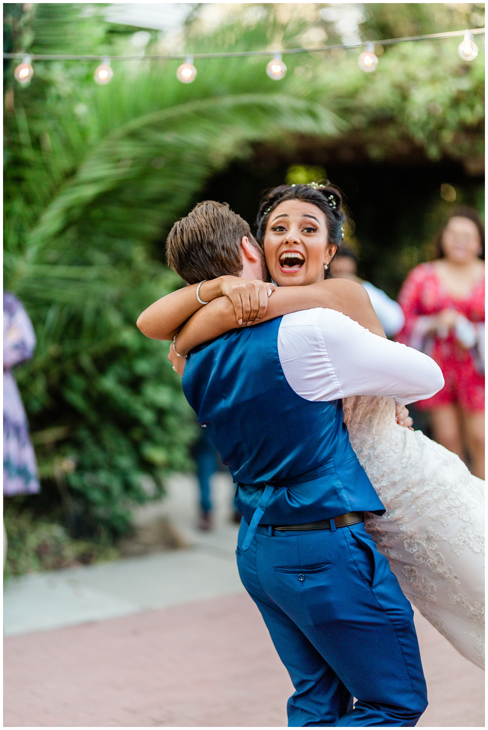 groom spinning the bride around during their first dance