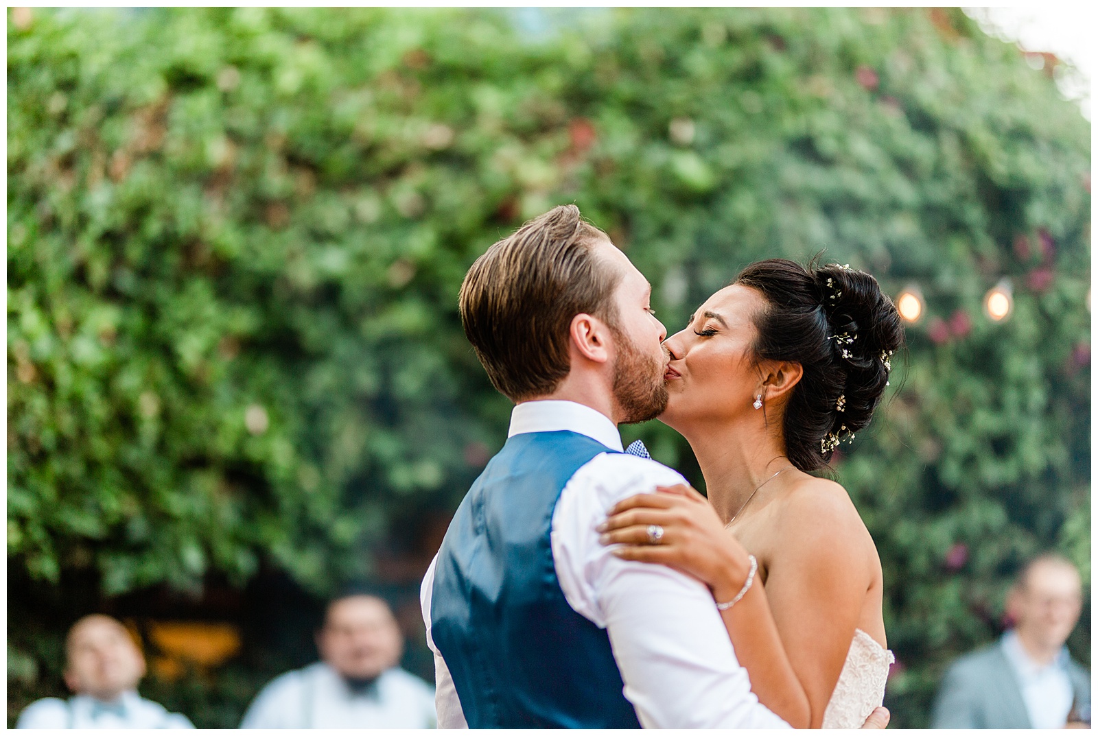 sweet moment of the bride and groom emotionally kissing during their first wedding dance