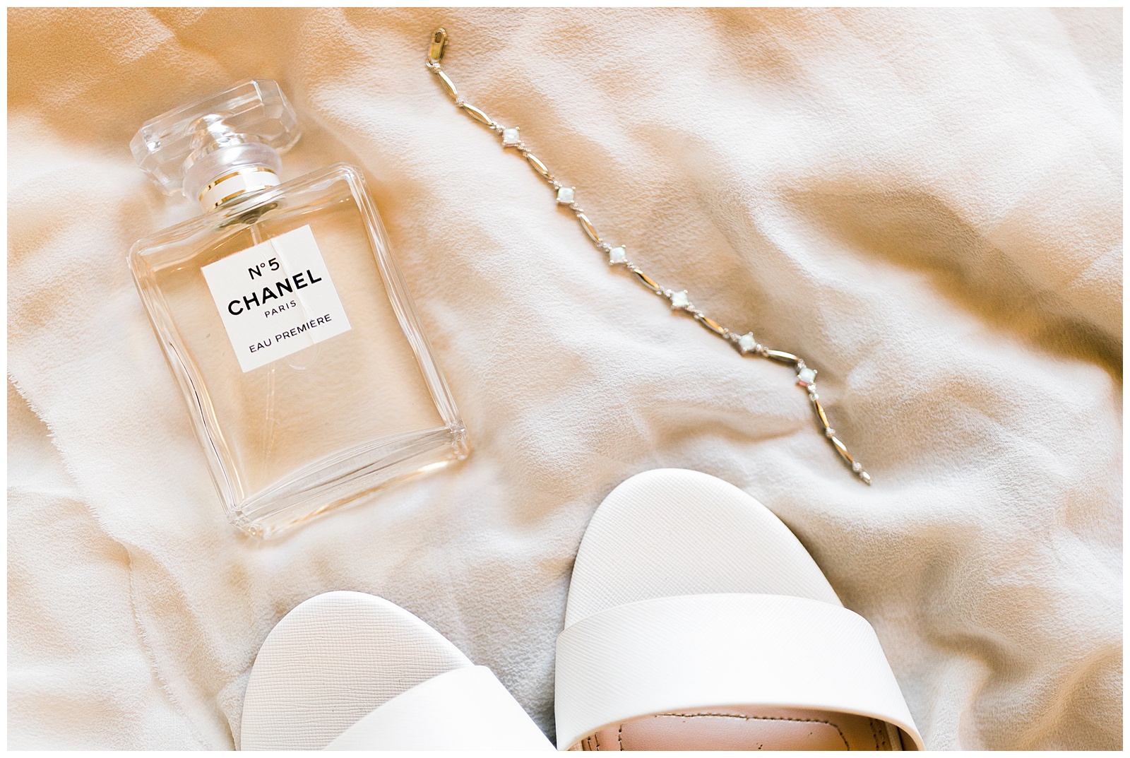 chanel no. 5 perfume and white sandals styled for wedding detail photos