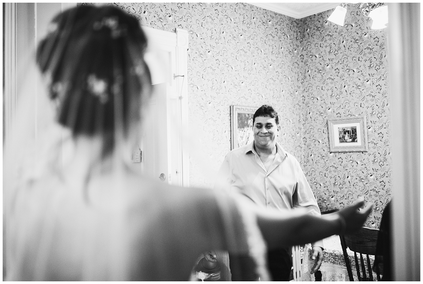 black and white photo of a brides first look with her father