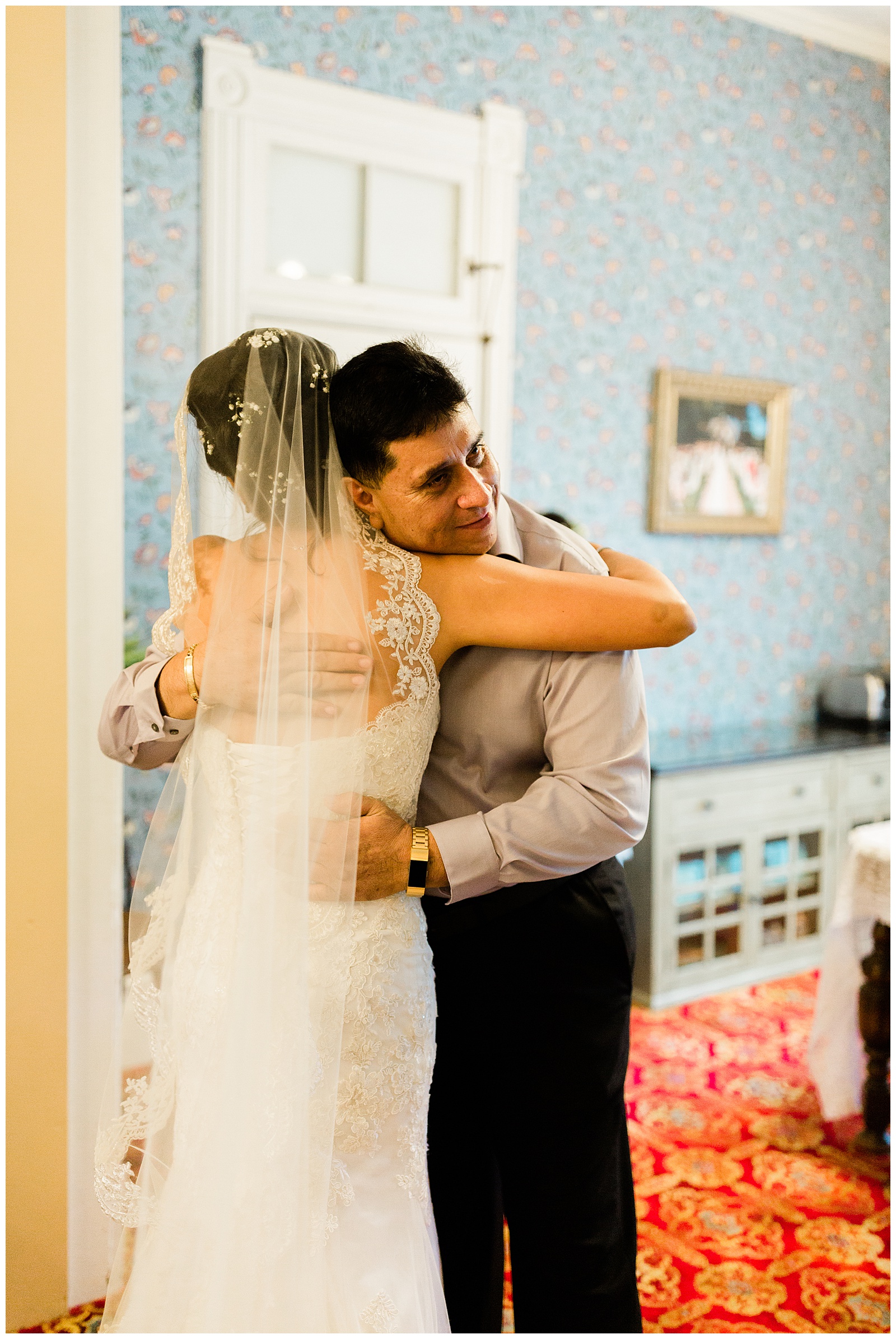father of the bride hugging her after seeing her for the first time