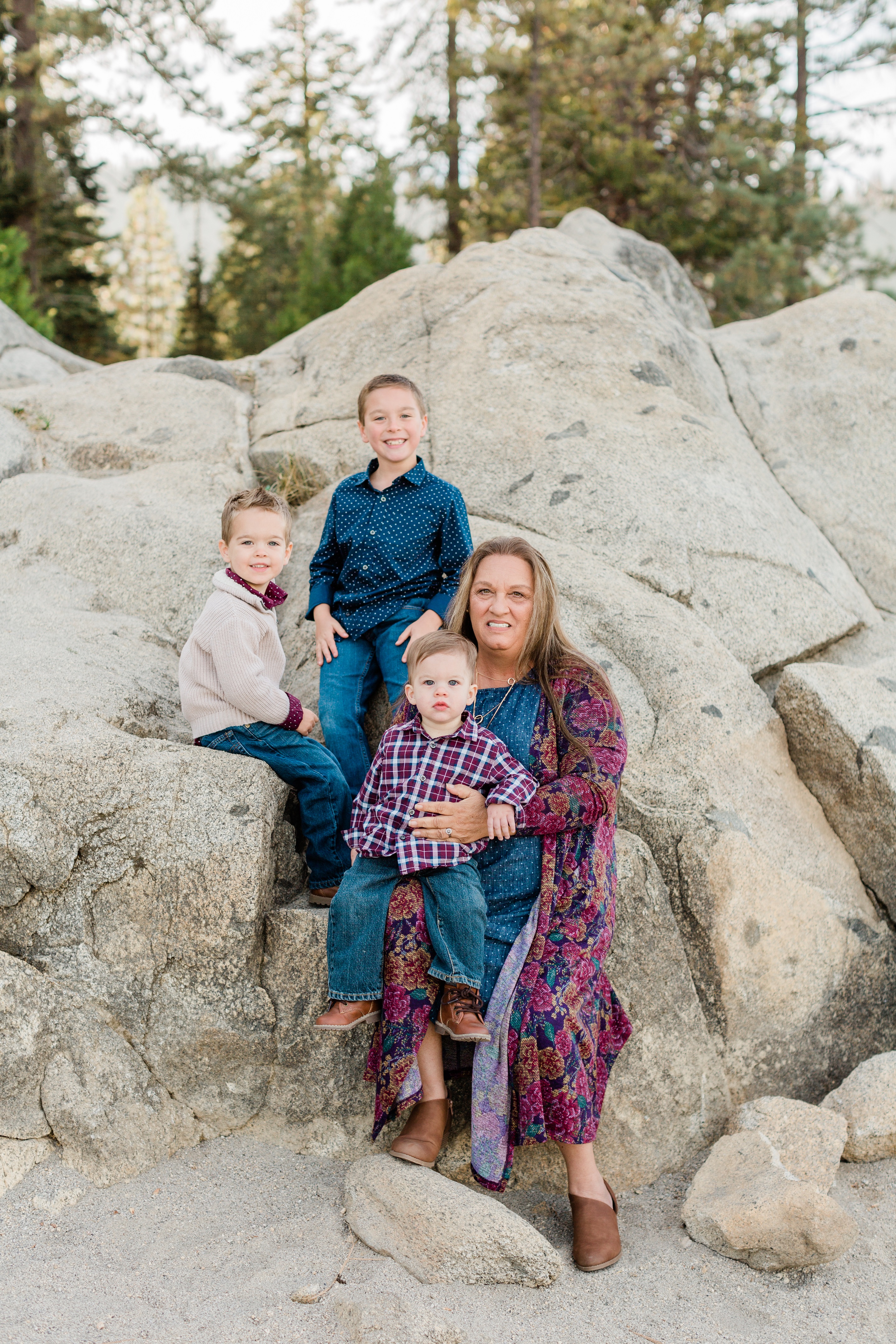 grandma posing with her grandkids at shaver lake for family photos