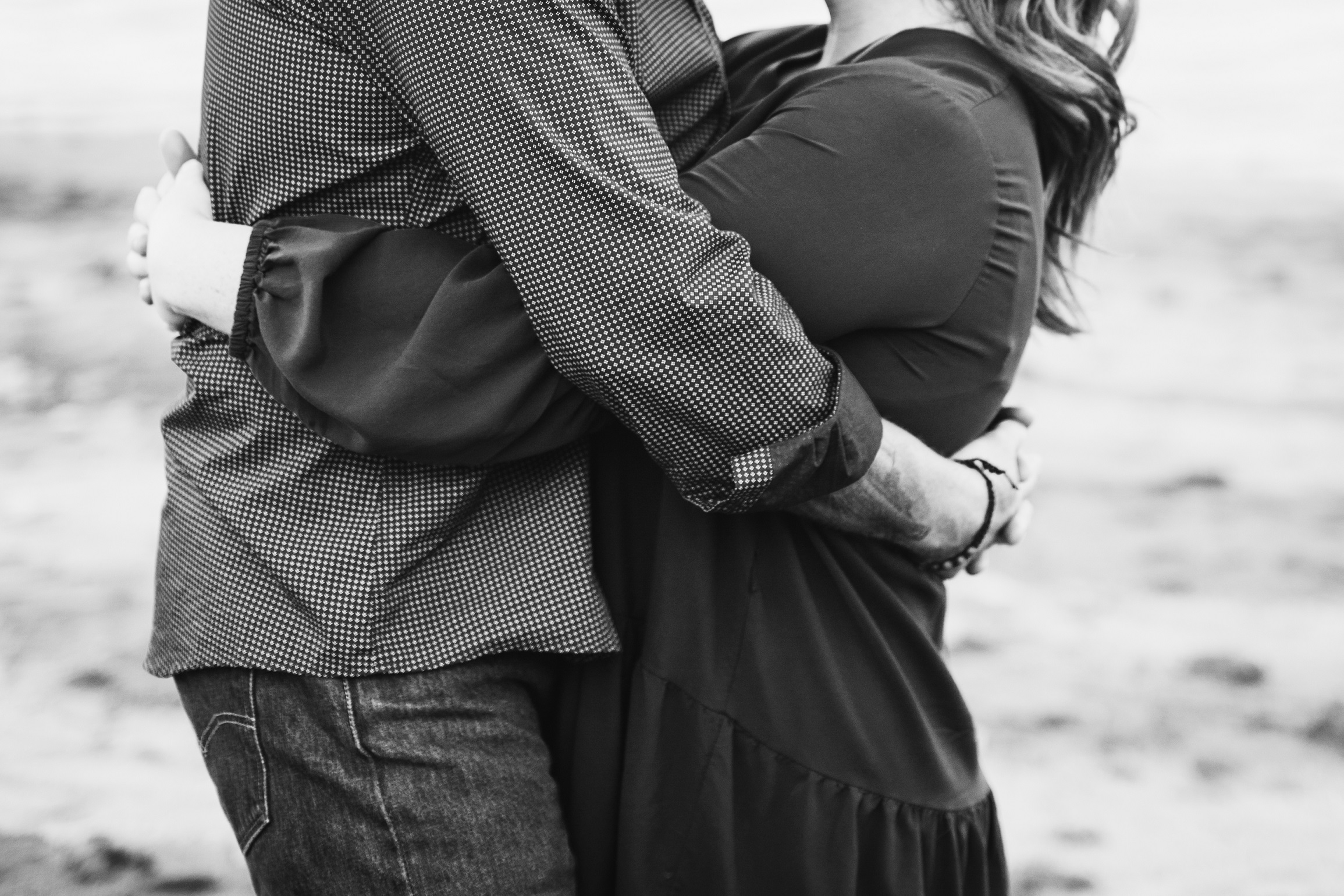 black and white photo of a couple embracing