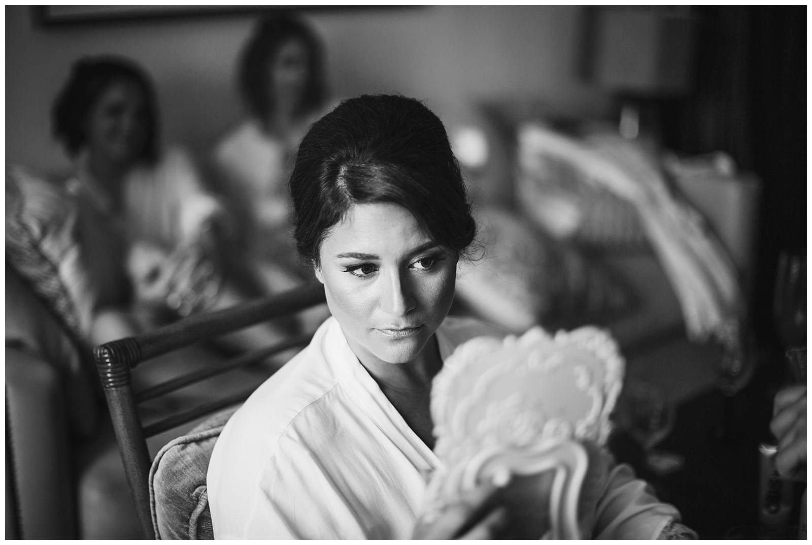 black and white moment of the bride getting ready