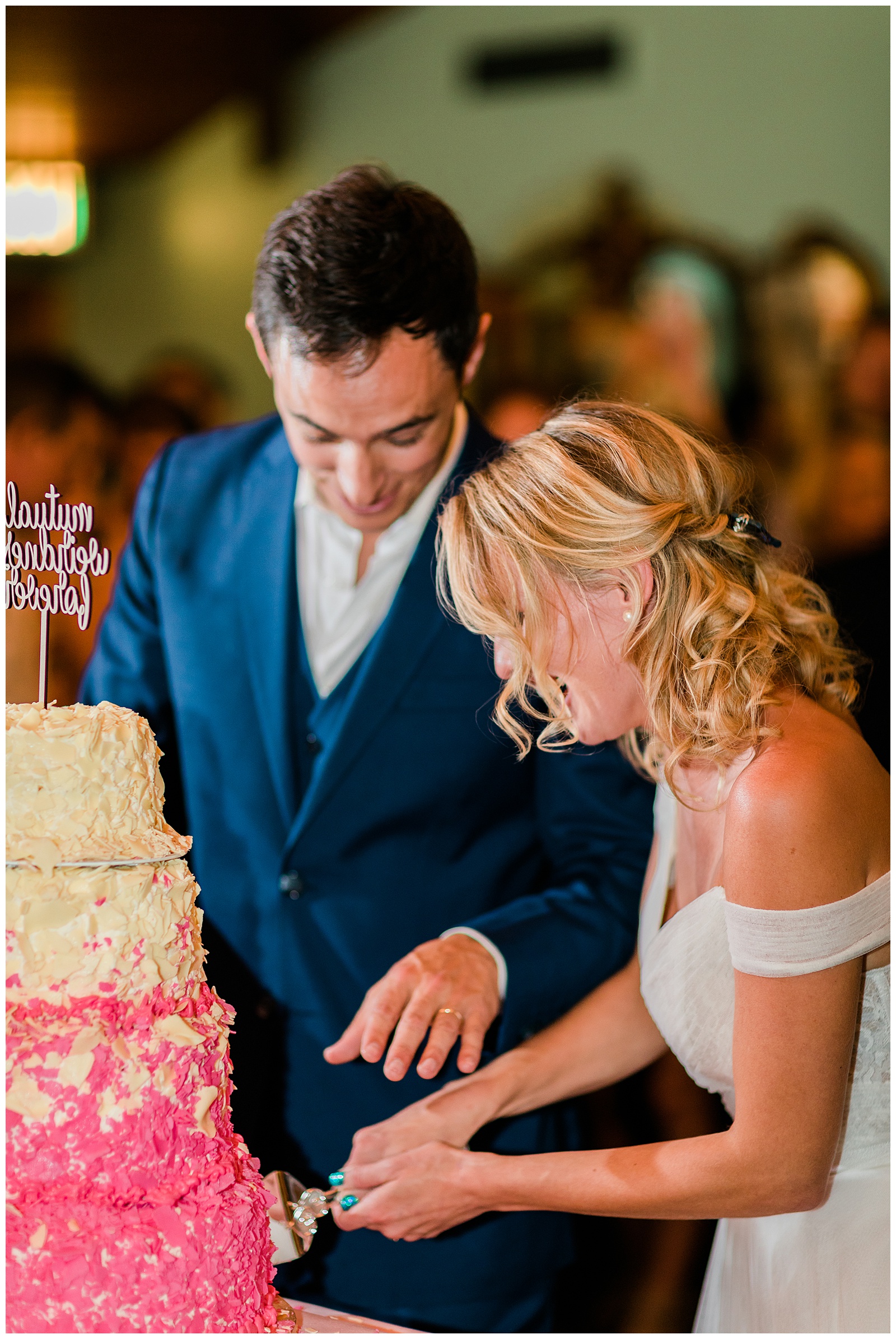 bride and groom cutting their pink champagne cake at the Madonna Inn