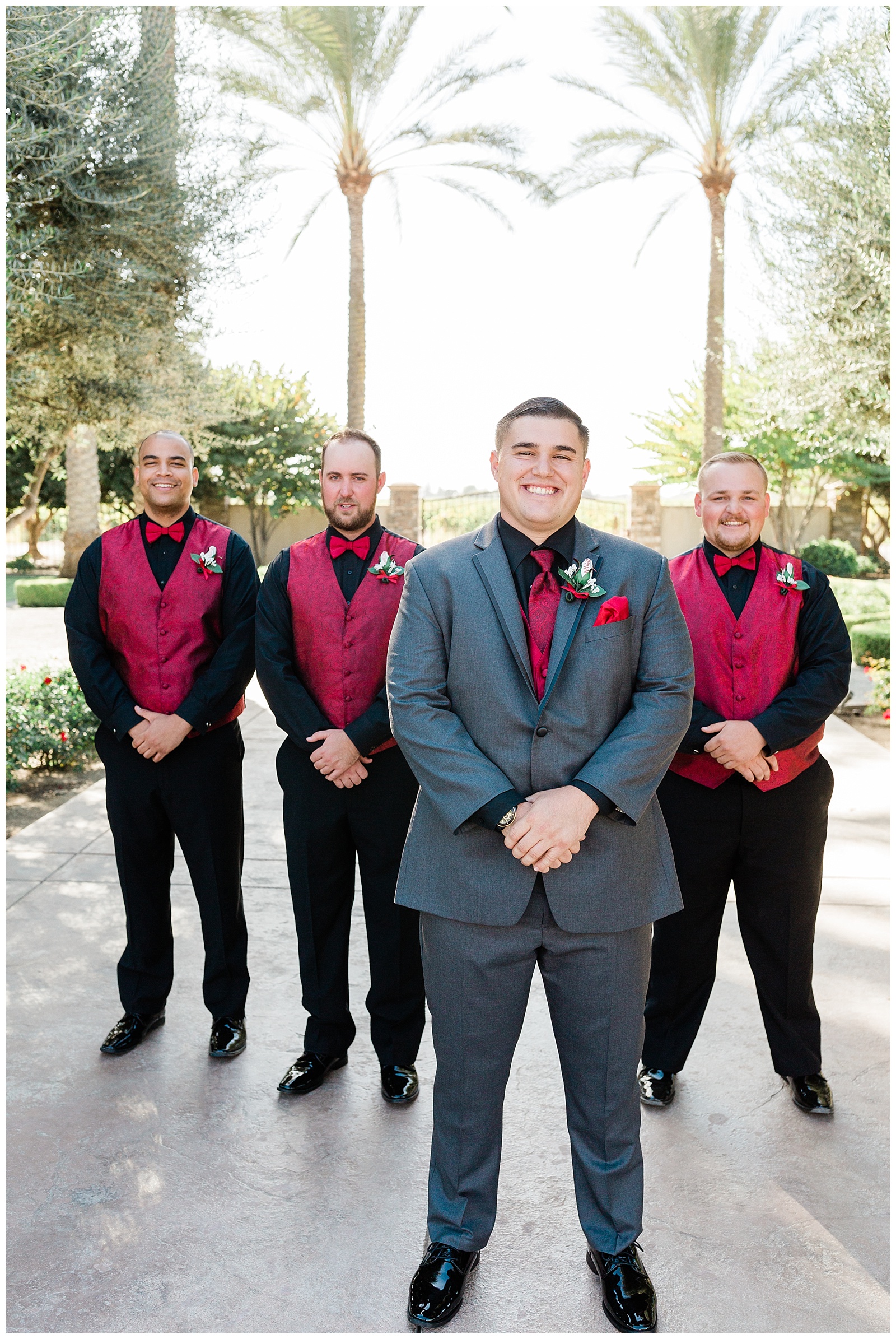 groom and his groomsmen hanging out on the driveway of Tuscan Gardens Venue in Kingsburg CA