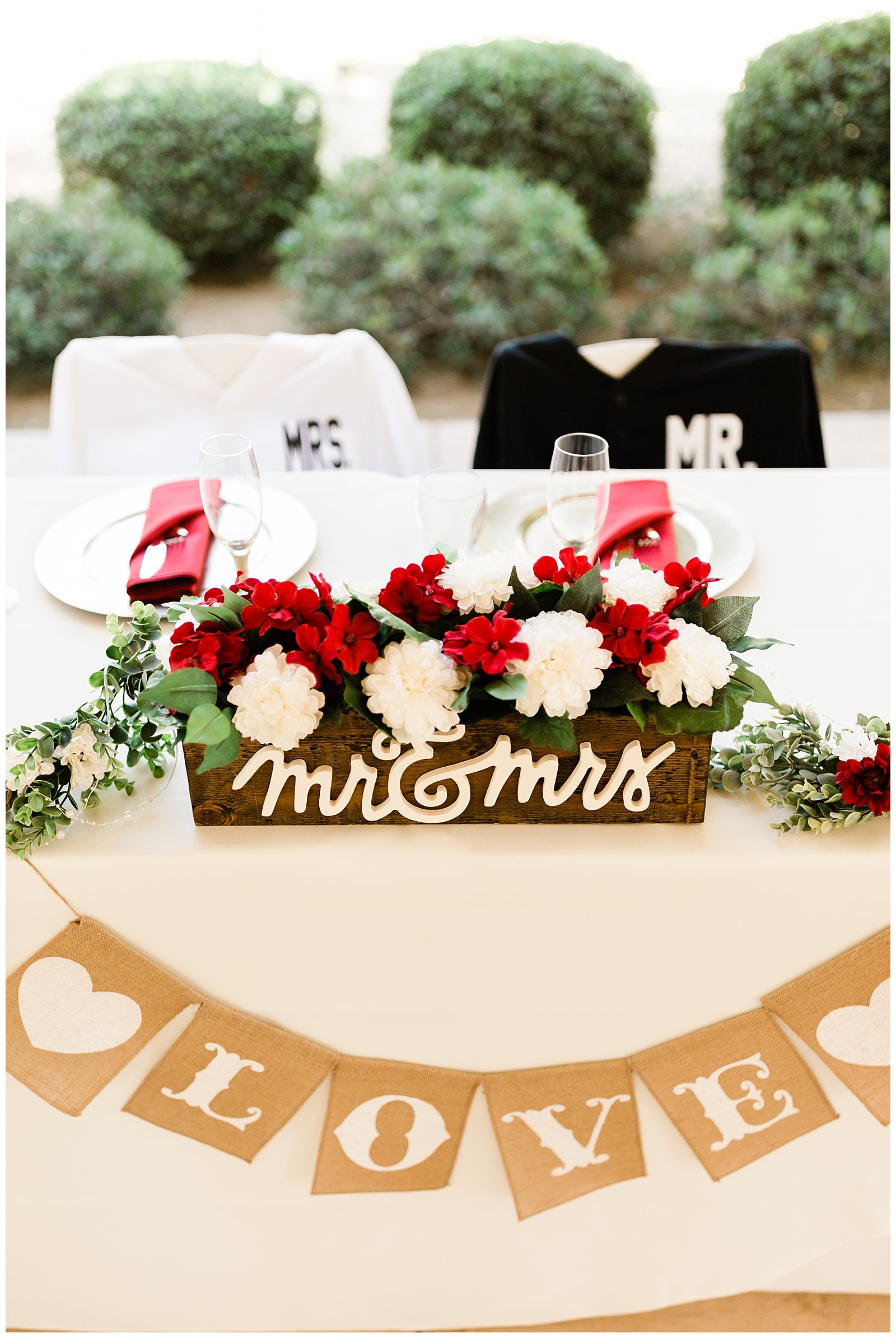 Baseball themed head table decor with custom bride and groom baseball jerserys