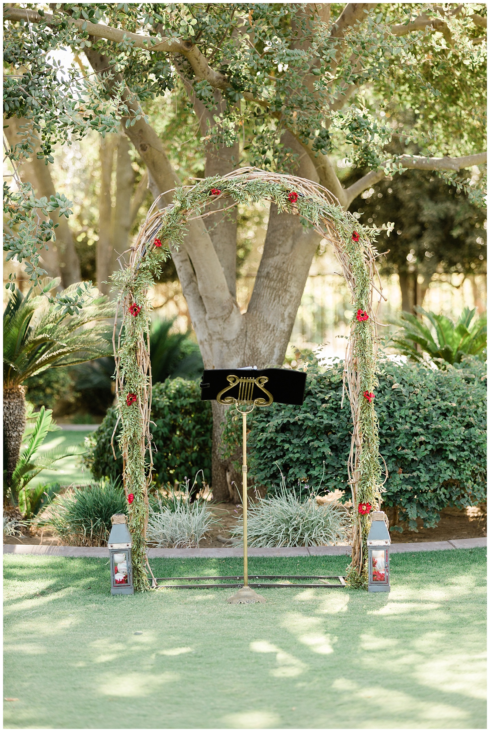 grapevine and greenery wedding arbor at the Tuscan Gardens Venue