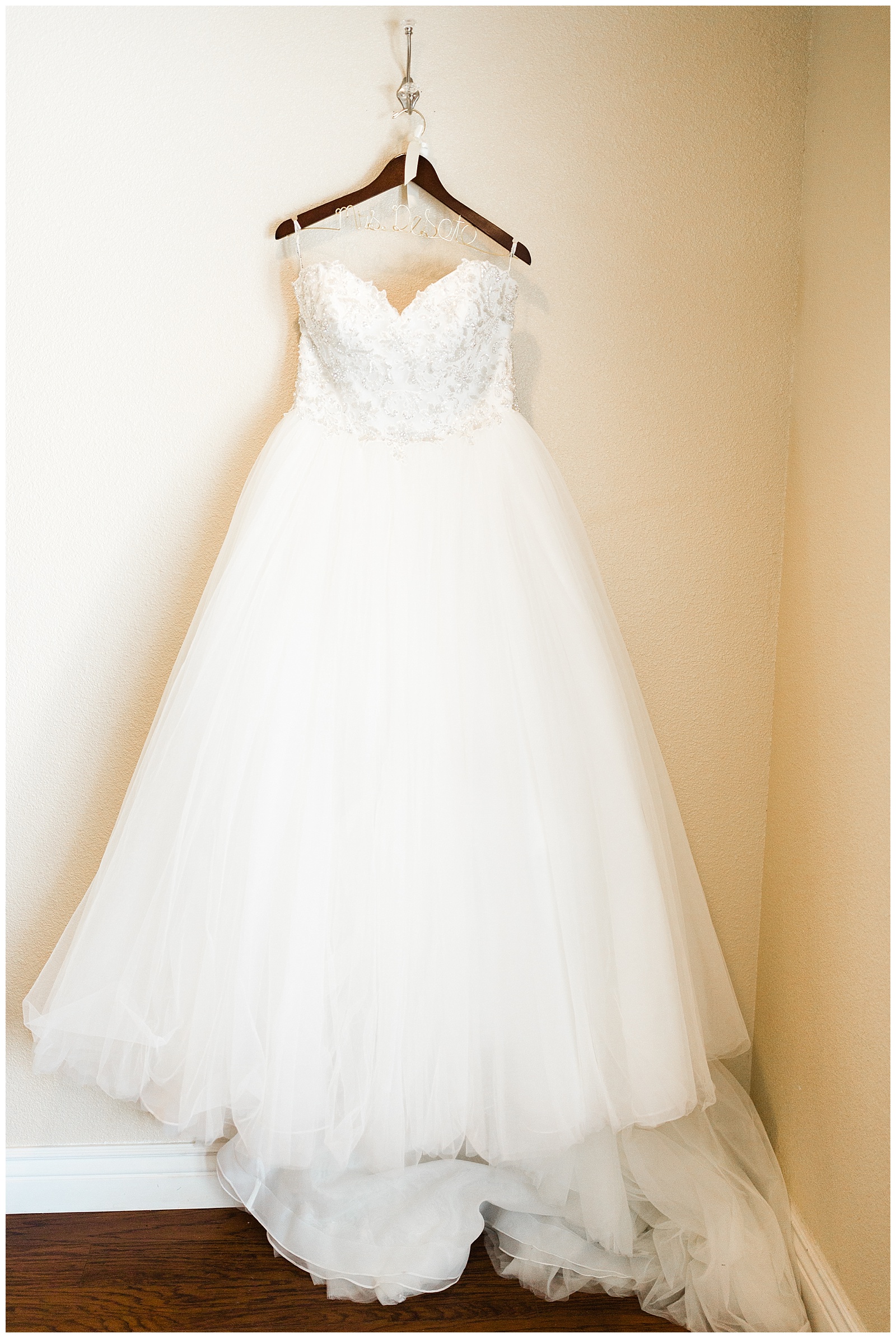 maggie sottero wedding dress hanging in the bridal suite