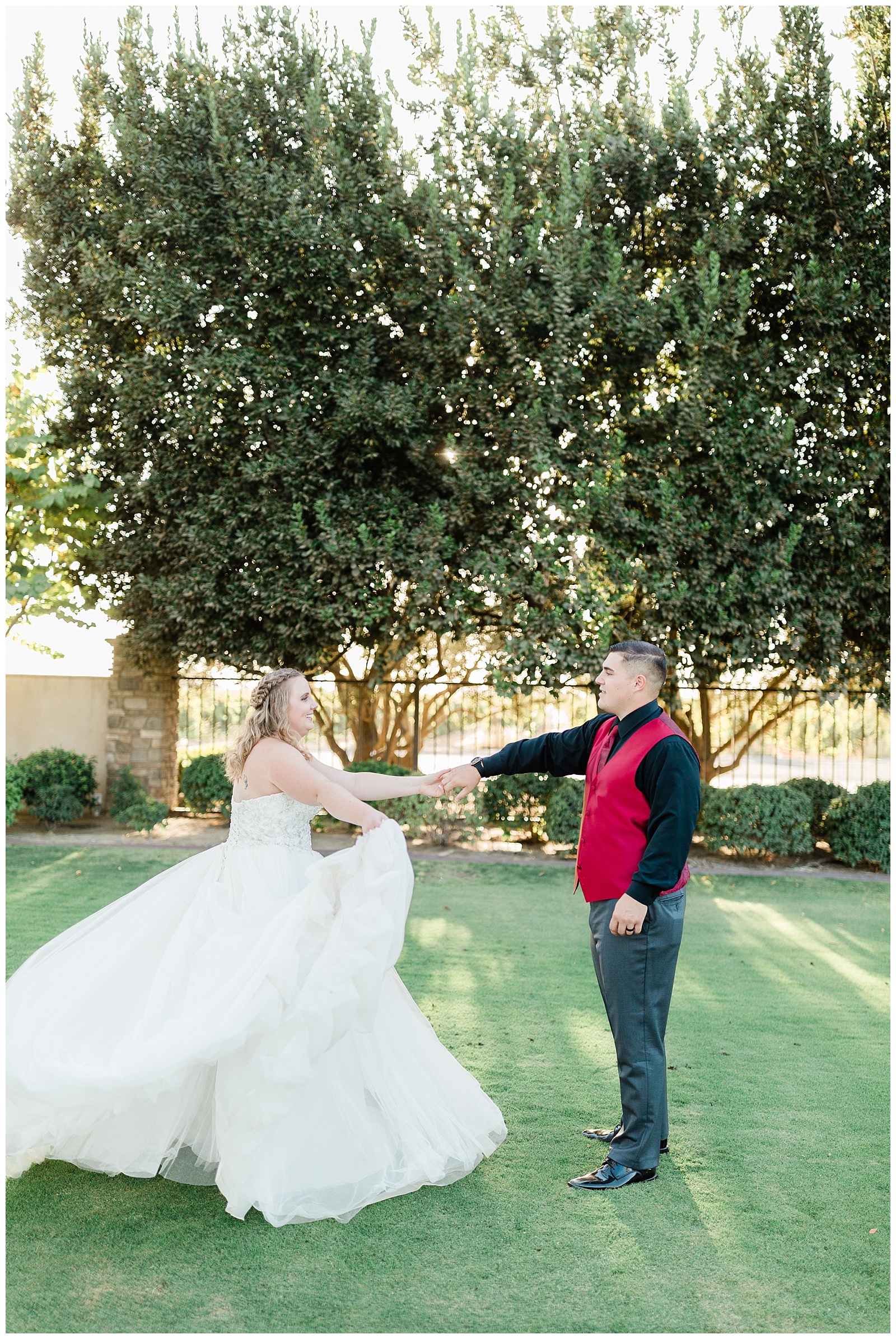 bride and groom dancing on the lawn at Tuscan Gardens, a fresno wedding venue