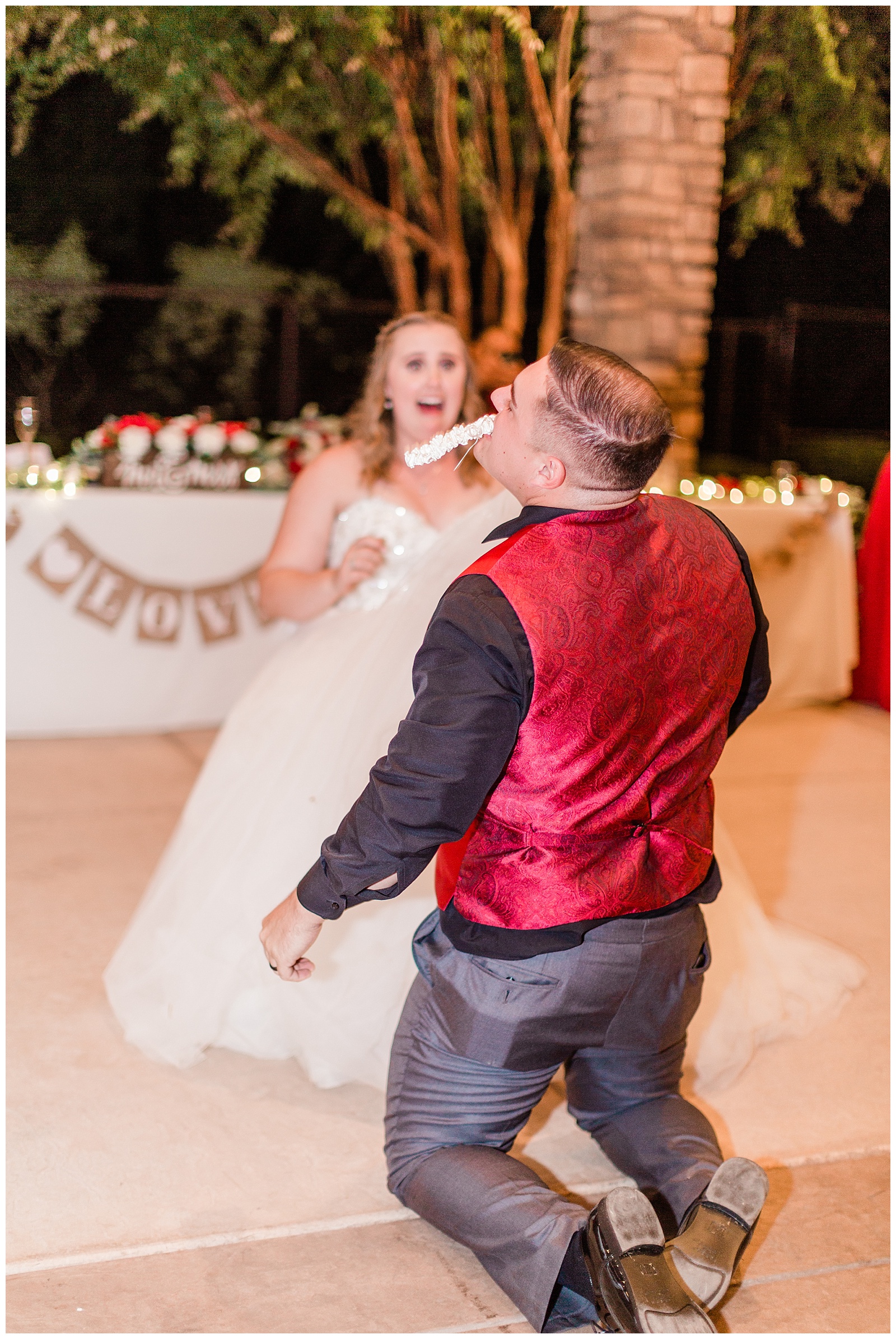 groom finding the garter with his teeth