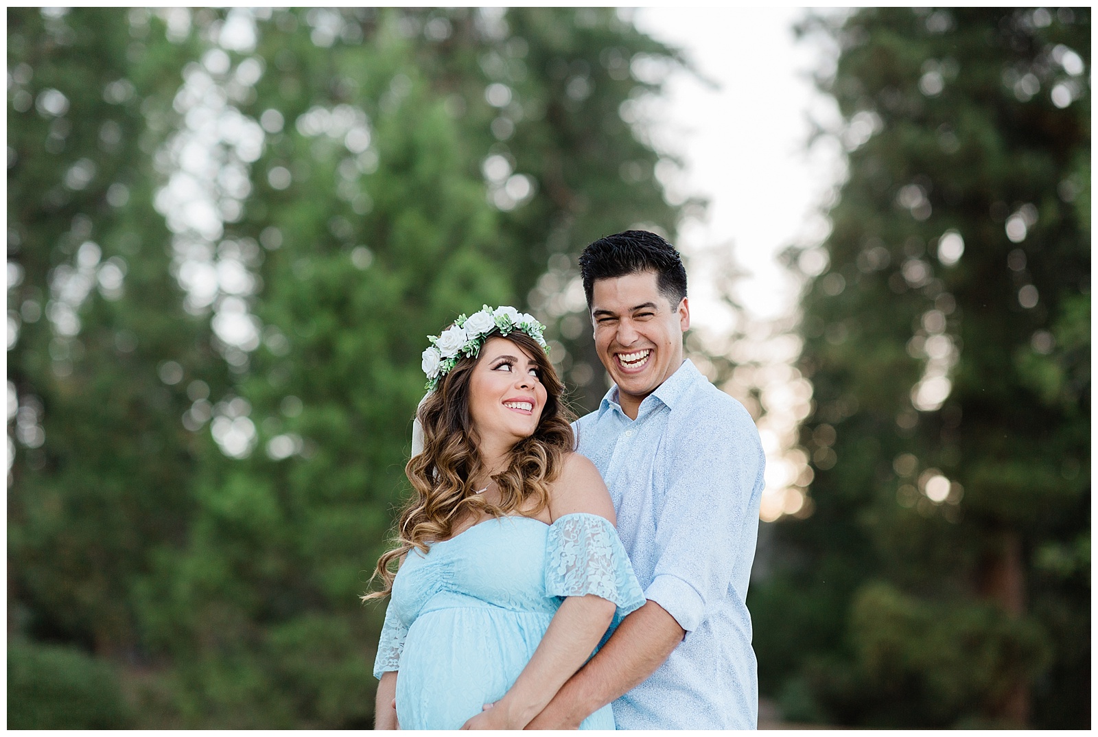 couple laughing during a maternity session at shaver lake