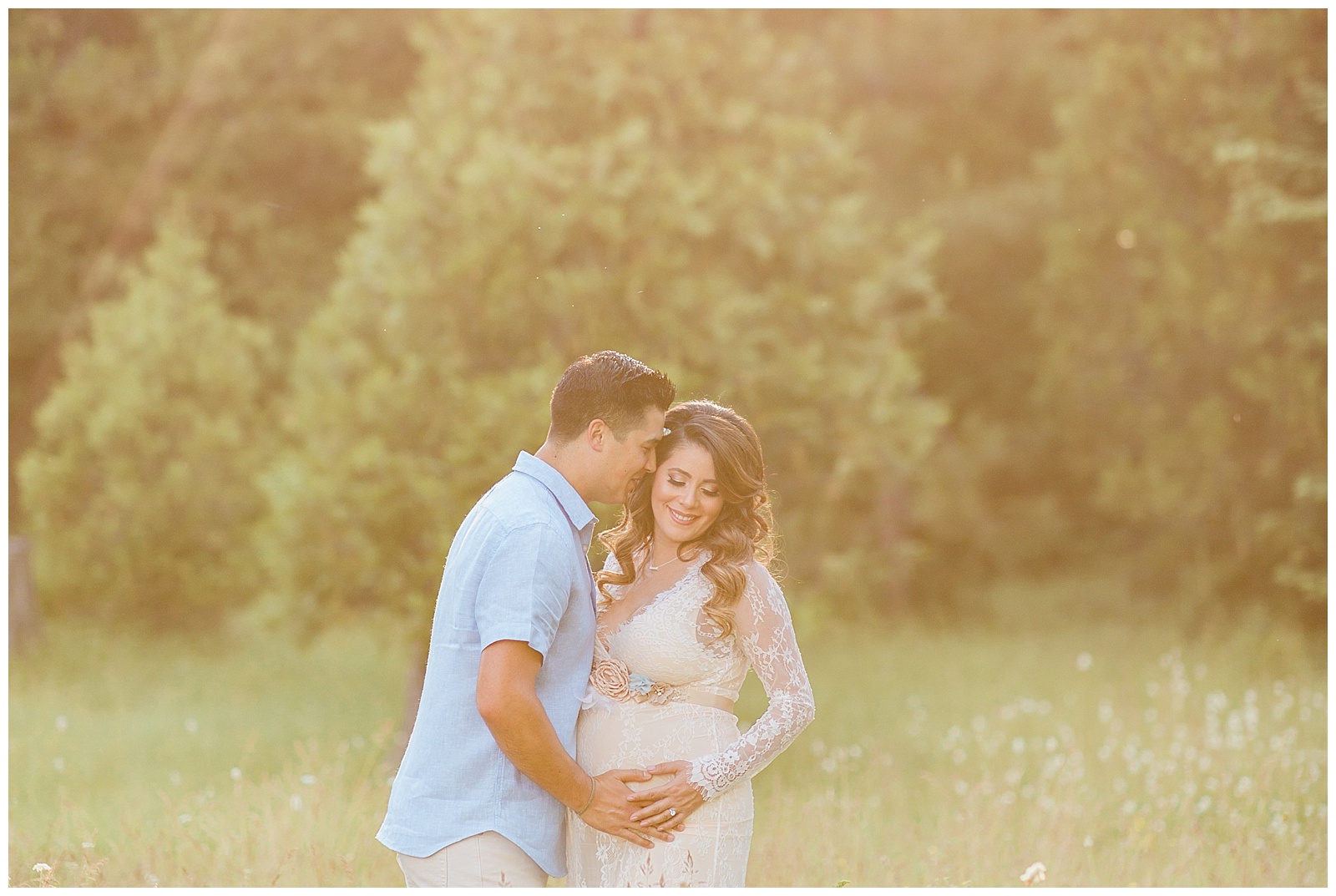 expecting couple smiling for maternity photos in a meadow in shaver lake california