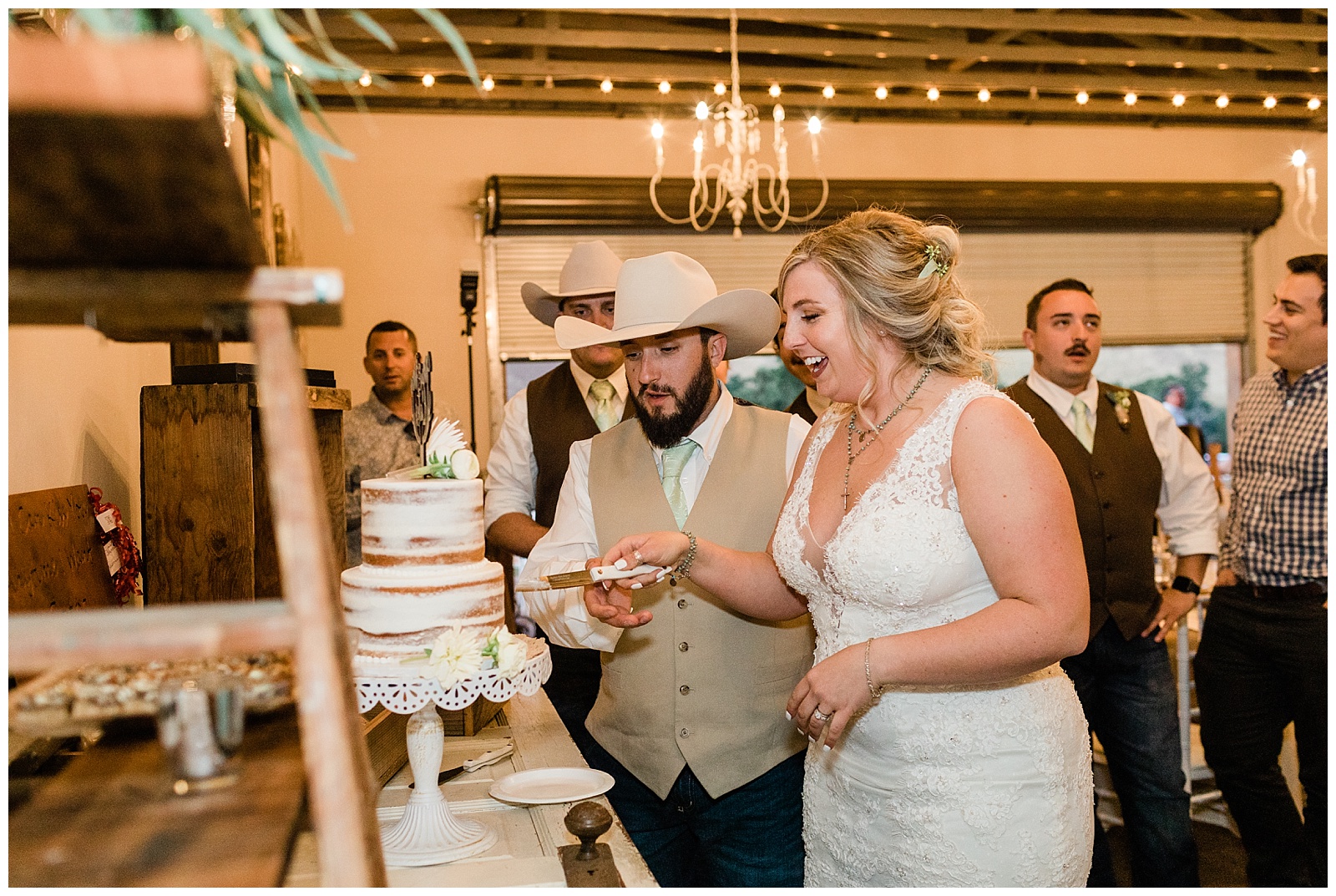 bride and groom cutting the cake