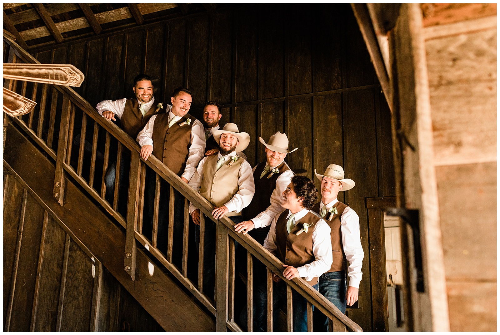 groomsmen on the staircase in the saloon at fox creek ranch weddings
