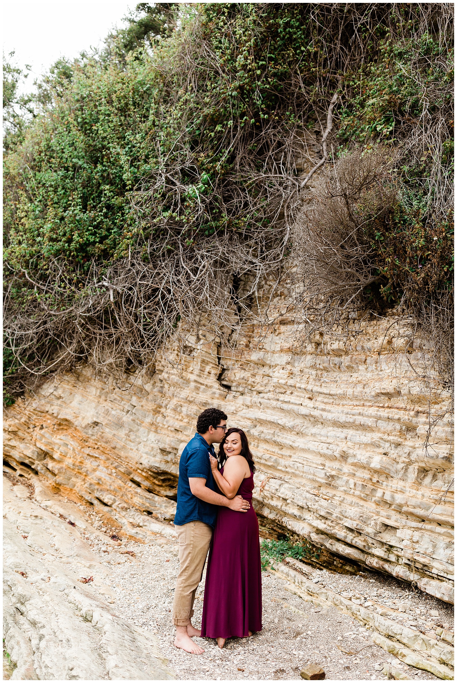 couple embracing on the rocks at montana de oro