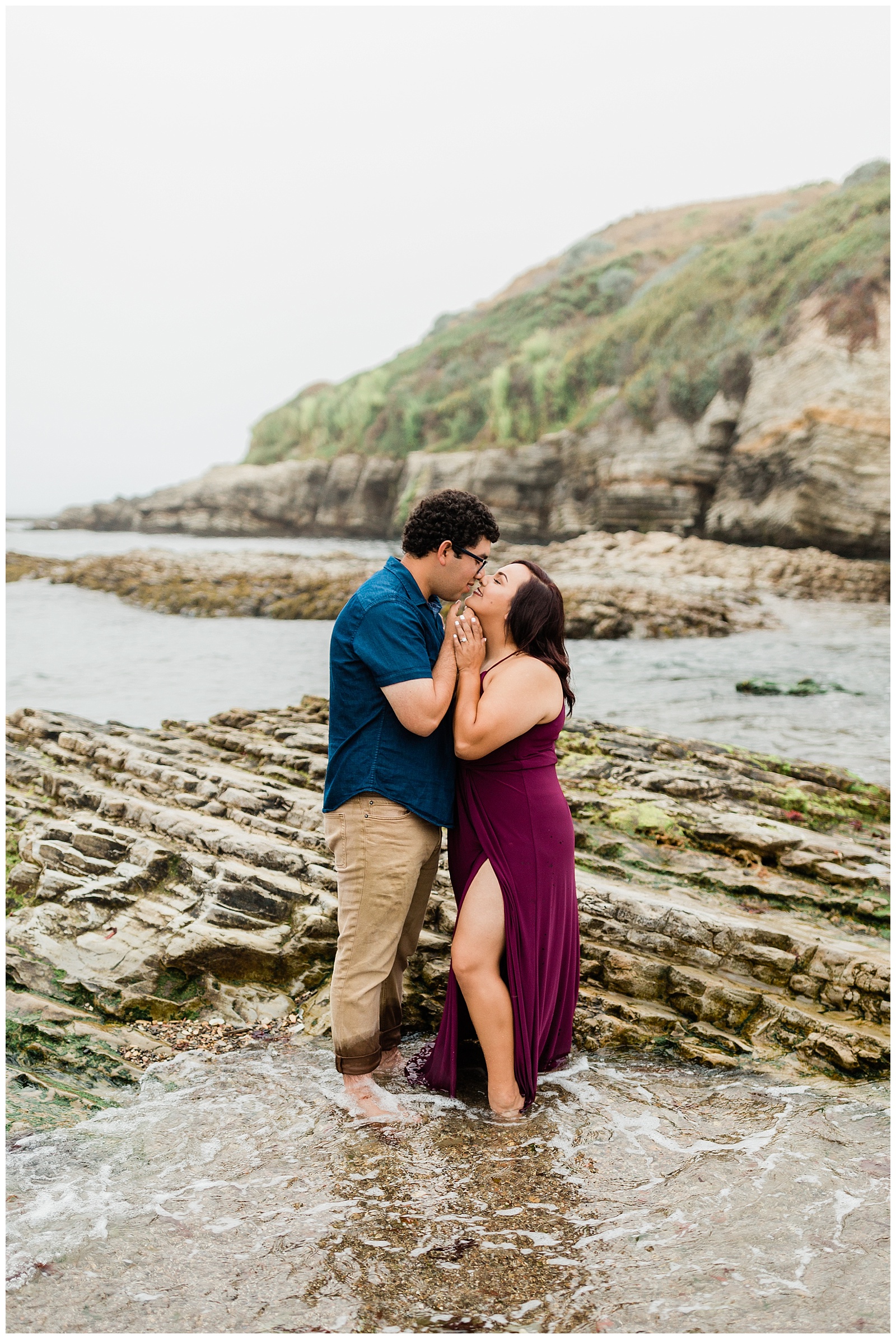 foggy coastal engagement photos of a couple almost kissing on the beaches of montana de oro