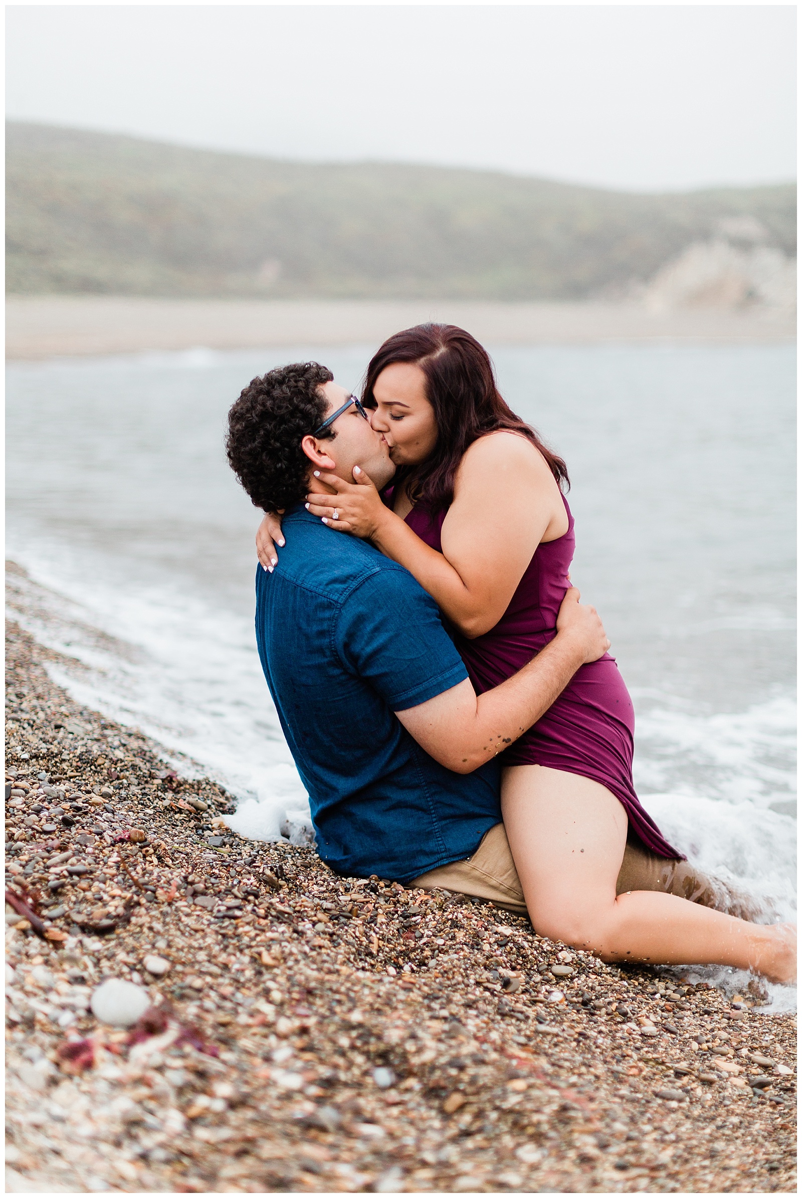 foggy coastal engagement photos on the beach in the water