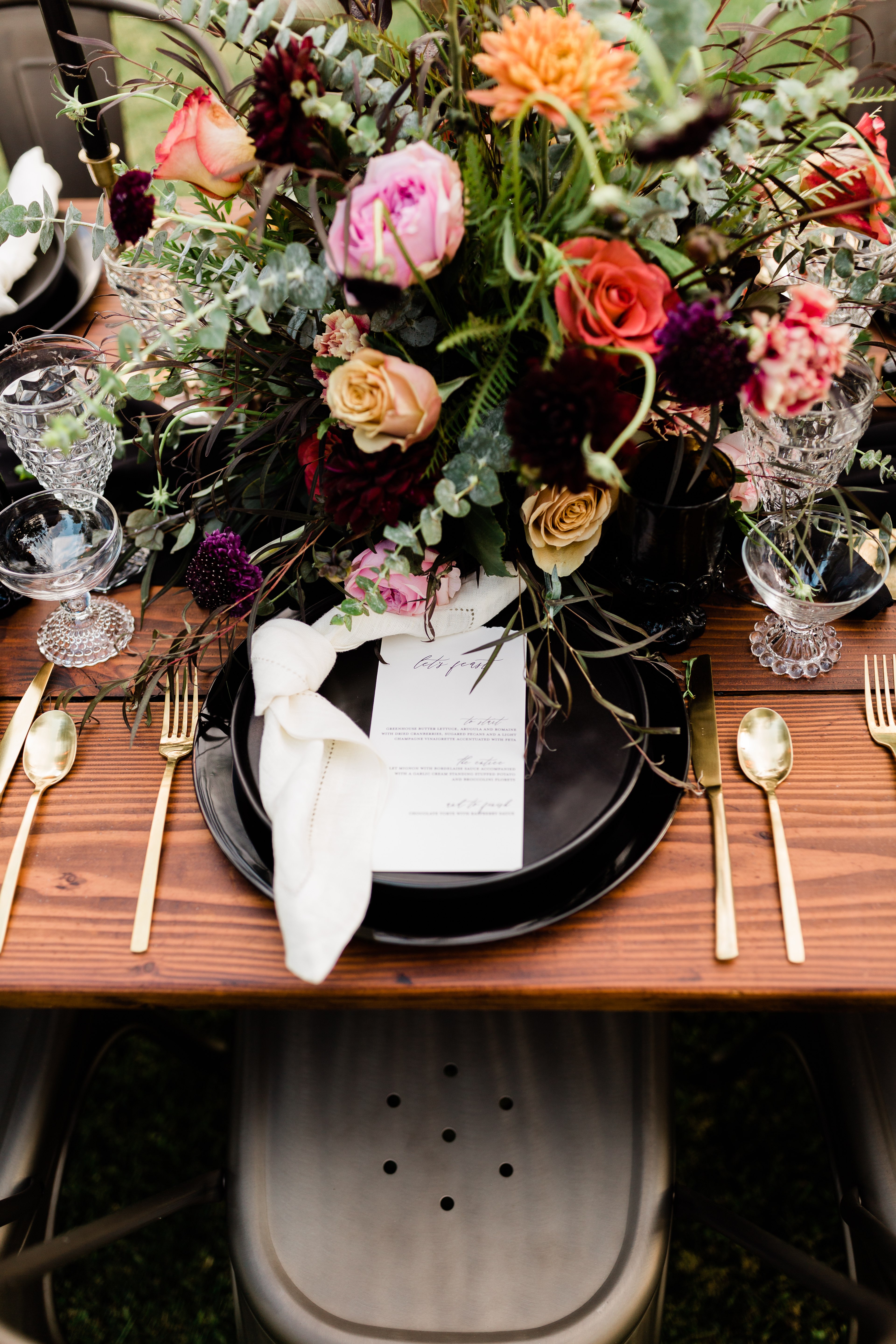 colorful fall wedding florals and metal chairs