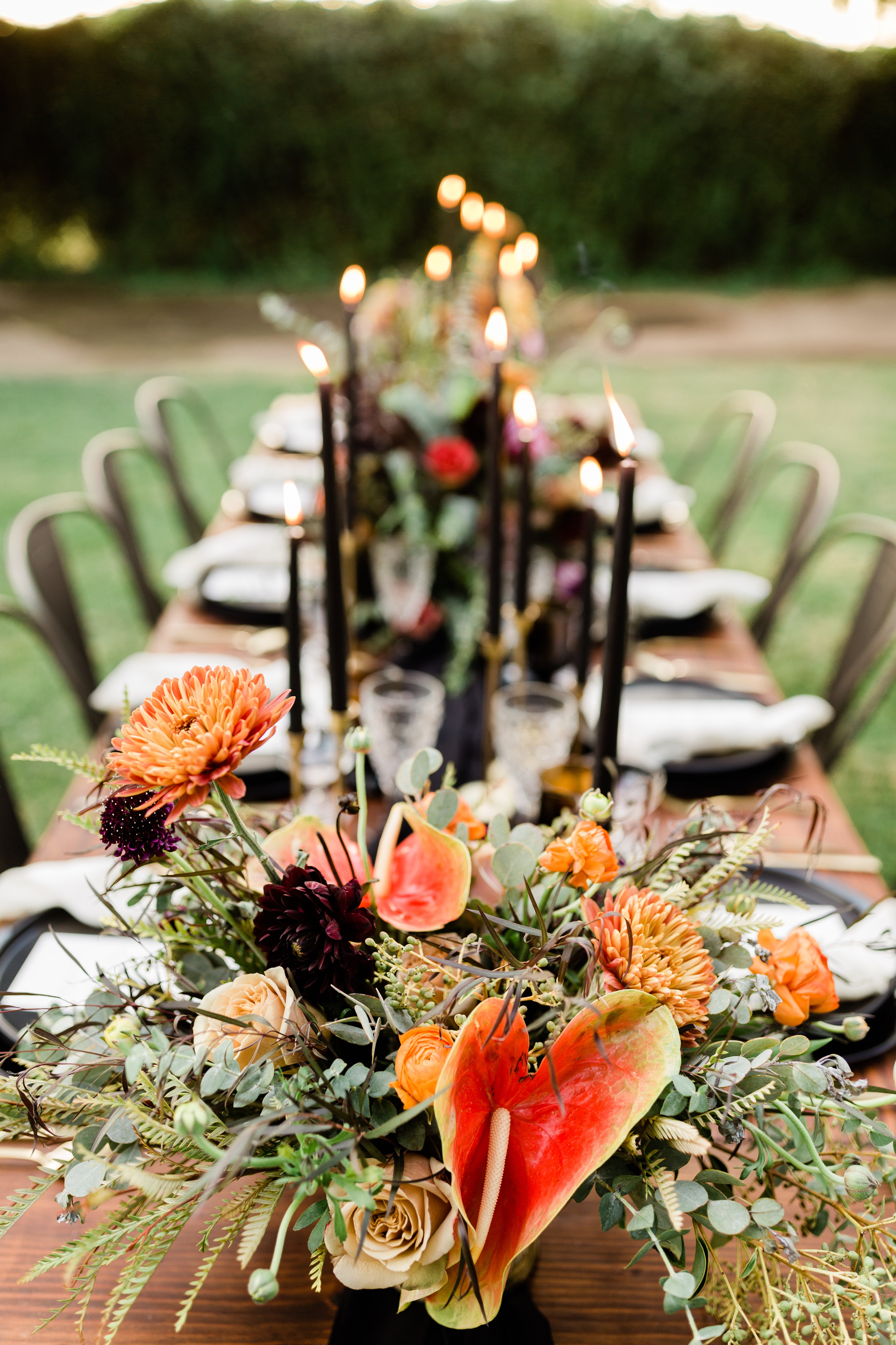 colorful fall wedding floral arrangements on a farm style wedding table
