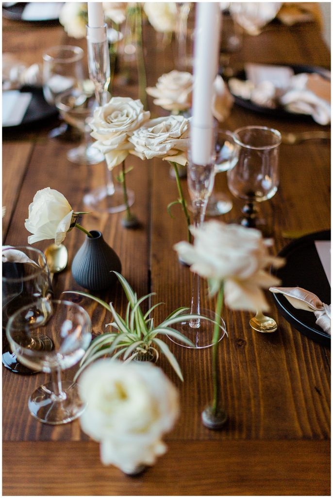 air plants and single rose florals for simple and minimal wedding decor 