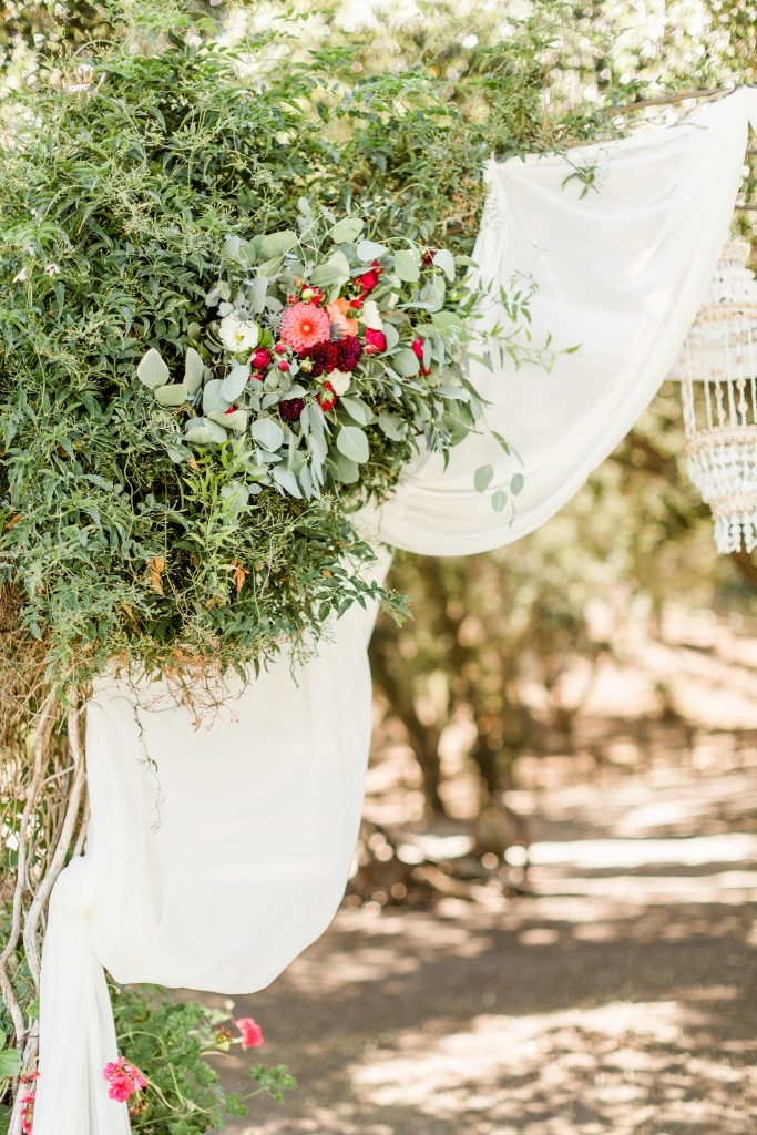 red and pink with eucalyptus wedding floral