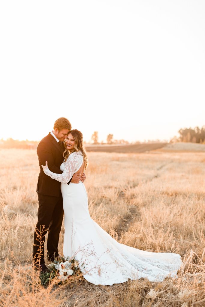 Sunset wedding portraits in the foothills of fresno for a winter wedding at christmas