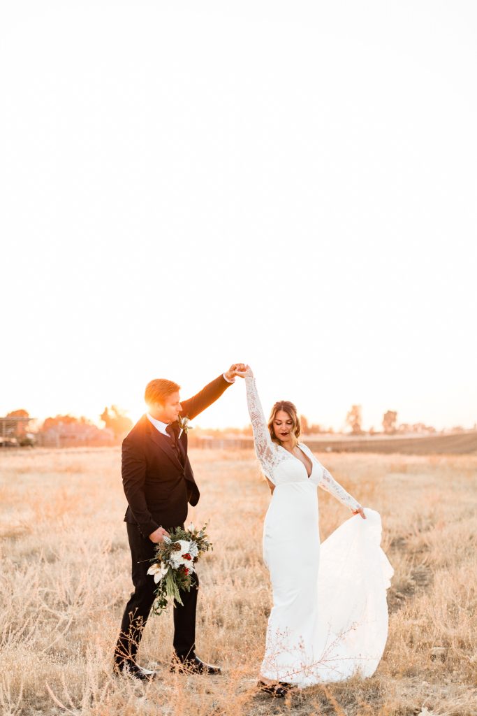 newlyweds dancing at sunset for a winter wedding
