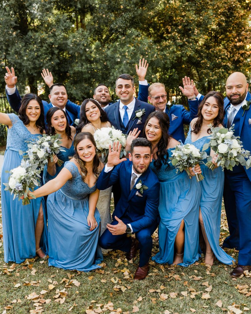 bridal party close together in blue