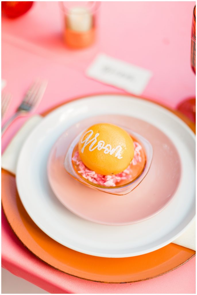 groom seat marker with blood orange and pink
