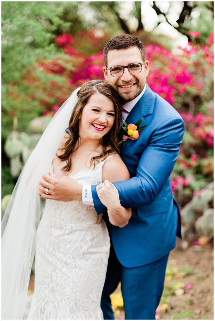 bride and groom with blue suit and pops of color