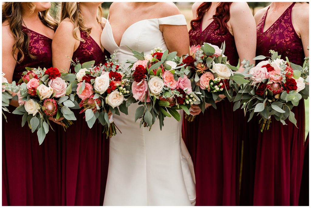 burgundy bridesmaid dresses and flower with pops of pink and eucalyptus 