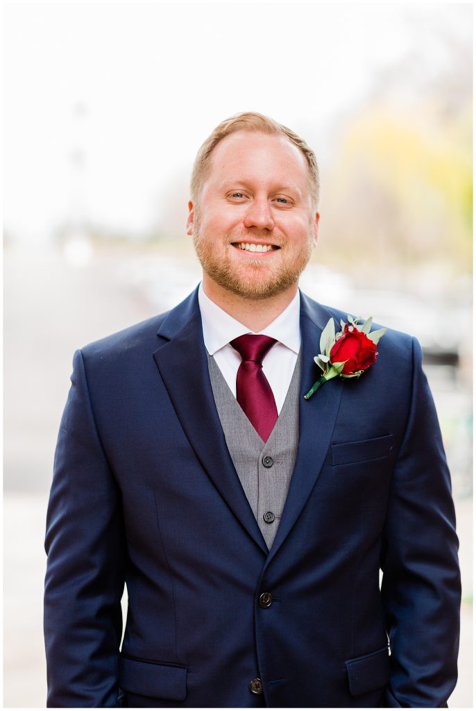 solo photo of groom in navy suit