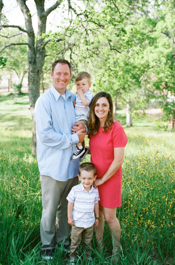 spring family photos with pops of color and tall grass