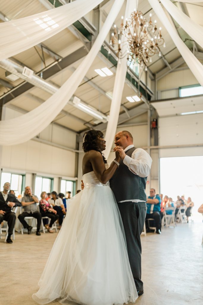 first dance for newly weds in draped barn at Kings River Winery