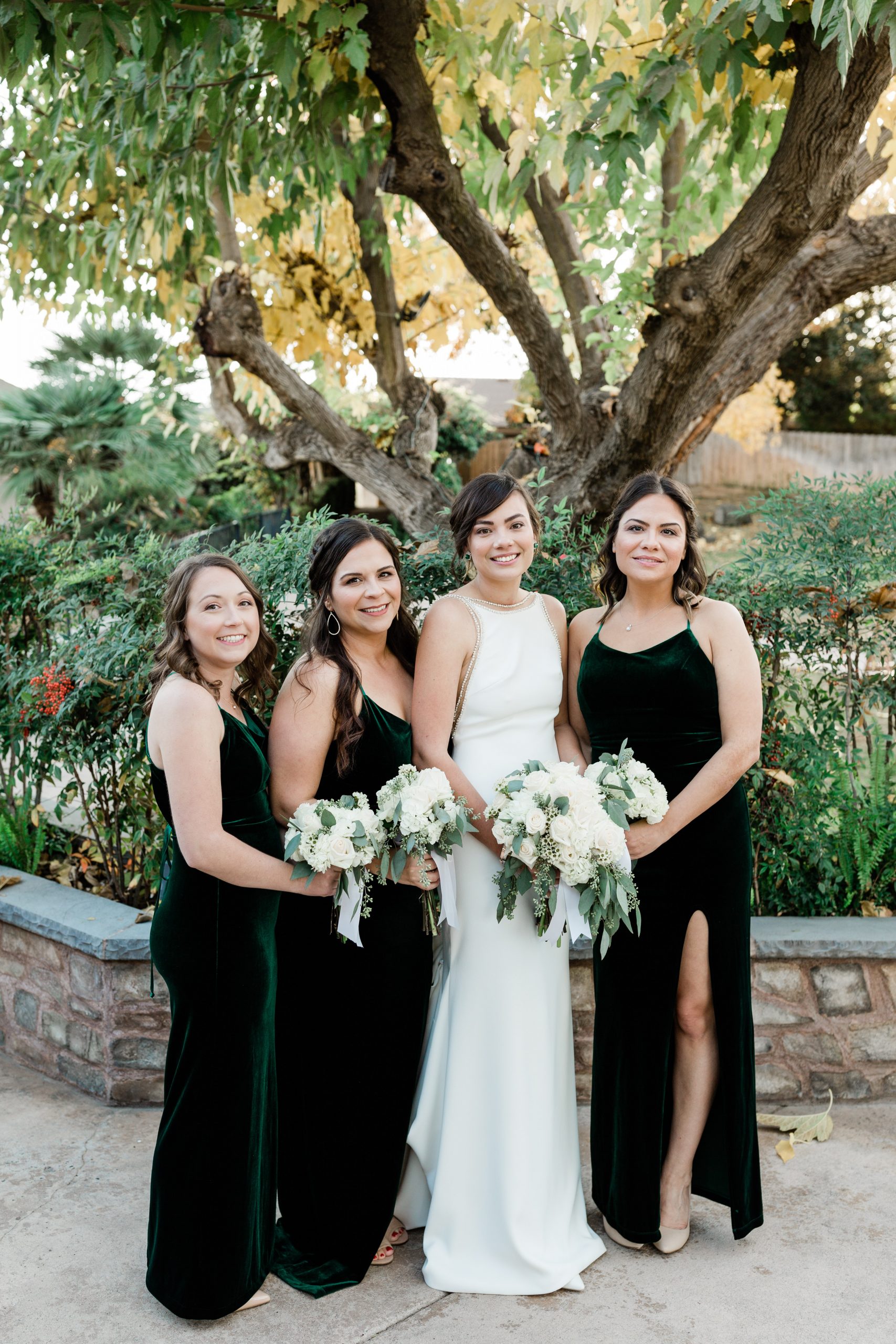 bride and bridesmaids with green velvet bridesmaid dresses