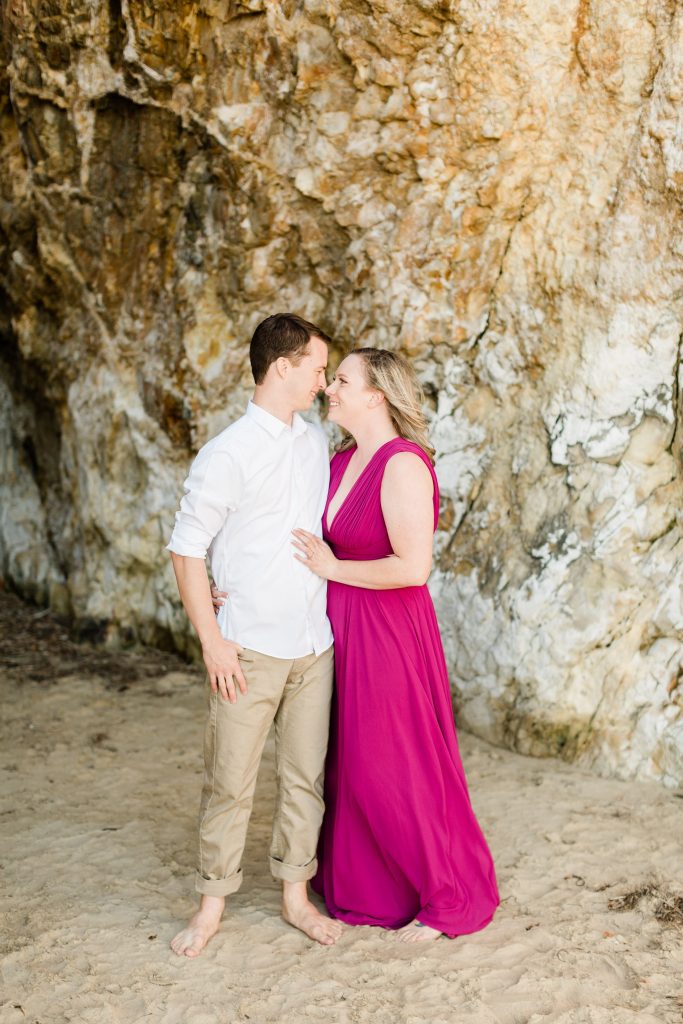 hot pink maxi dress for beach engagement photos