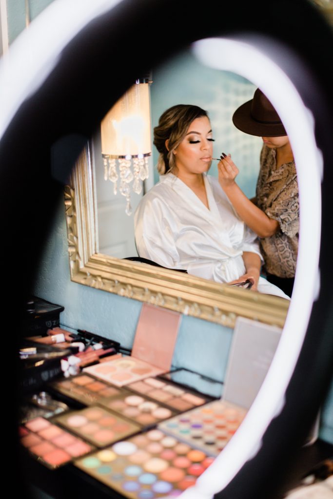bride getting her makeup done 