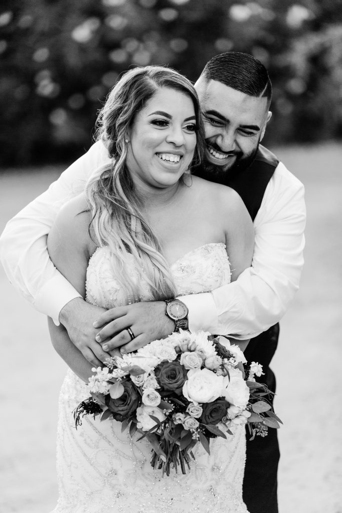 candid black and white bride and groom portrait