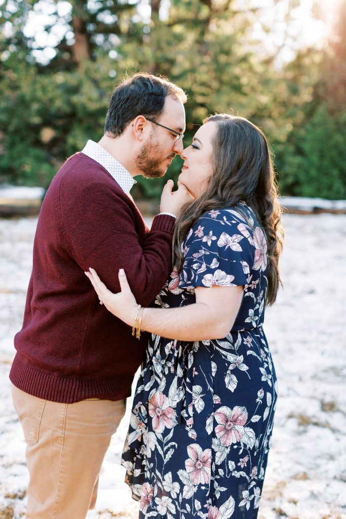 engaged couple nose to nose for eskimo kisses for a winter engagement session with fresno wedding photographer megan helm